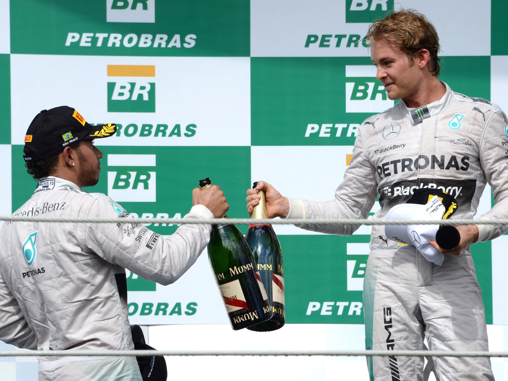 Mercedes-AMG-Petronas-German-driver-Nico-Rosberg--celebrates-on-the-podium-with-teammate-Lewis-Hamilton